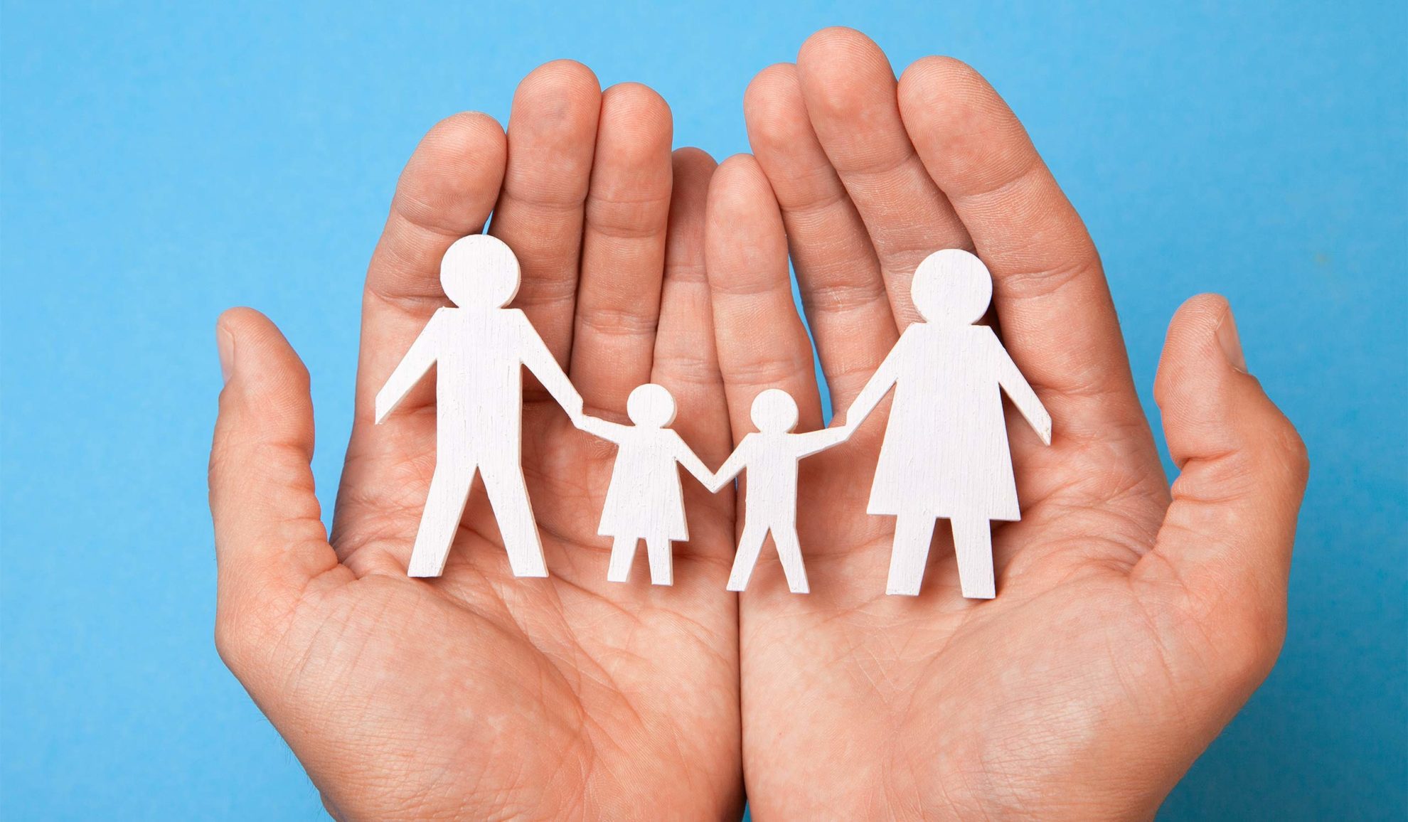 open hands close up with paper cutted family on top chesapeake va